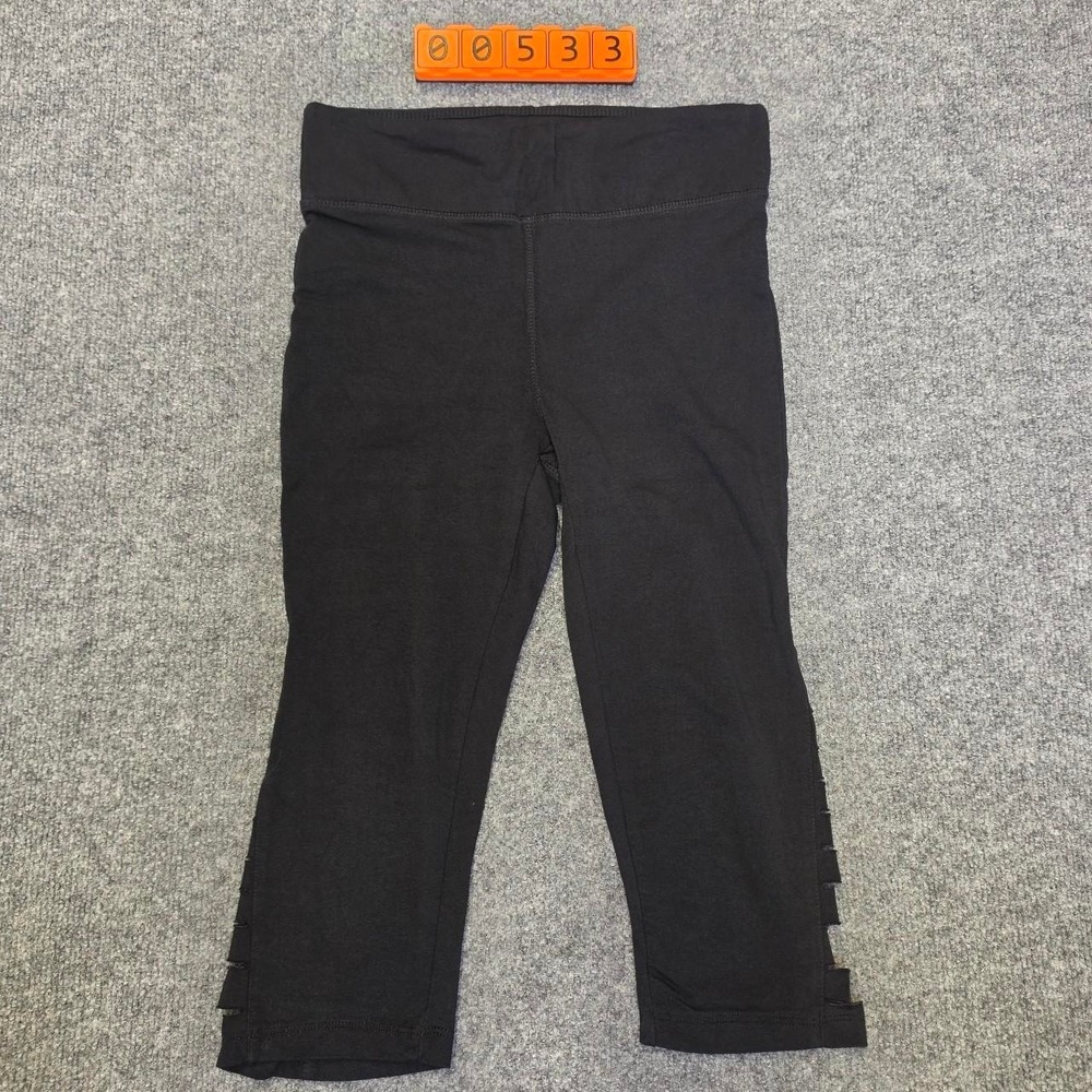 French Laundry black capri leggings with cut-out details on the sides, size S.